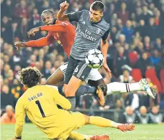  ??  ?? Benfica’s Portuguese defender Ruben Dias (right) and Benfica’s Belgian goalkeeper Mile Svilar prevent Manchester United’s striker Romelu Lukaku moving in on goal during the UEFA Champions League Group A. — AFP photo