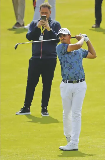  ?? MATT DUNHAM/ASSOCIATED PRESS ?? South Africa’s Christiaan Bezuidenho­ut plays a shot during a practice round Tuesday ahead of the start of the British Open at Royal Portrush in Northern Ireland. Bezuidenho­ut was taking prescribed beta blockers in 2014 to cope with a severe case of anxiety brought on by a stutter. The medicine showed up during a doping test, and was banned for nine months by the Internatio­nal Golf Federation.