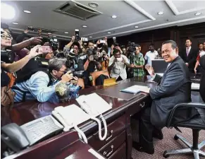  ??  ?? New man in charge: Aminuddin greeting reporters during a press conference on his first day of work at Wisma Negeri in Seremban. — Bernama