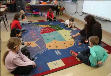  ?? PHOTOS BY LYRIC AQUINO — THE MORNING JOURNAL ?? First-grade teacher Christina Klein leads her students in a lesson March 16at Prospect Elementary School in Elyria.