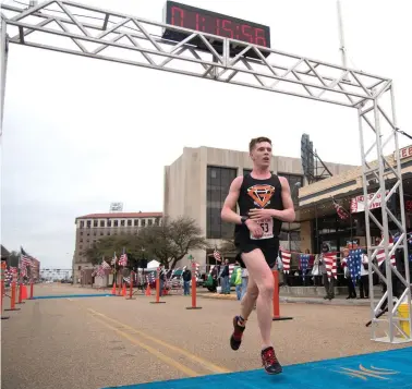  ?? Photo by Kaitlyn Gordon ?? Nathan Hall, 33, of Monroe,La., was the winner of the Run The Line half-marathonon Sunday in downtown Texarkana. See related storyon Page 1B.