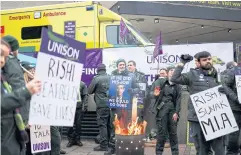  ?? REUTERS ?? Ambulance workers strike over a dispute with the government over pay, in London on Jan 23.