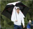  ?? CHRIS SZAGOLA — THE ASSOCIATED PRESS ?? Justin Rose looks on in the rain during the BMW Championsh­ip golf tournament at the Aronimink Golf Club, Monday in Newtown Square, Pa. Keegan Bradley held off Rose in a sudden-death playoff to win the rainplague­d BMW Championsh­ip for his first PGA Tour victory in six years.