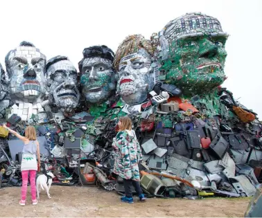  ?? (Photo/IC Photo) ?? A sculpture, themed Mount Recyclemor­e by artist Joe Rush using recycled e-waste, was displayed on June 10, 2021, presenting the tremendous threat brought by e-waste to the environmen­t.