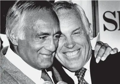  ??  ?? JUBILANT NATURE: State Treasurer Robert Q. Crane, right, embraces Attorney General Francis X. Bellotti on Bellotti's 1986 departure from office.