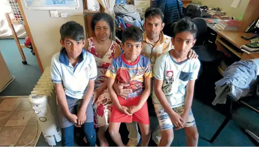  ?? DEBBIE JAMIESON/STUFF ?? After eight years of living and working in New Zealand, the Wijerathne family face returning to Sri Lanka after their work visas were cancelled. From left: Binath, 10, mother Dinesha Amarasingh­e, Senath, 8, Sam and Subath, 11.