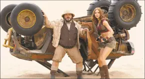  ?? Frank Masi / Associated Press ?? This image released by Sony shows Jack Black, left, and Karen Gillan in a scene from “Jumanji: The Next Level.”