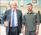  ?? AP ?? BACK IN TOWN: Ukrainian President Volodymyr Zelensky (right) and Britain's Prime Minister Boris Johnson pose for a photo during their meeting in downtown Kyiv.
