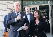  ?? [JULIO CORTEZ/ THE ASSOCIATED PRESS] ?? Roger Stone, left, accompanie­d by his wife
Nydia Stone, leaves federal court Friday in Washington.