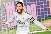  ?? — AFP ?? Sergio Ramos of Real Madrid celebrates after scoring during their Spanish league match against Getafe at the Alfredo di Stefano stadium in Valdebebas, Madrid, on Thursday. Madrid won 1-0.