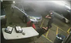  ?? COURTESY OF BATON ROUGE POLICE DEPARTMENT VIA AP ?? In this still image taken from security camera video provided Friday by the Baton Rouge Police Department, officers Blane Salamoni and Howie Lake II confront Alton Sterling (left) during a struggle outside the Triple S Food Mart in Baton Rouge, La., in...