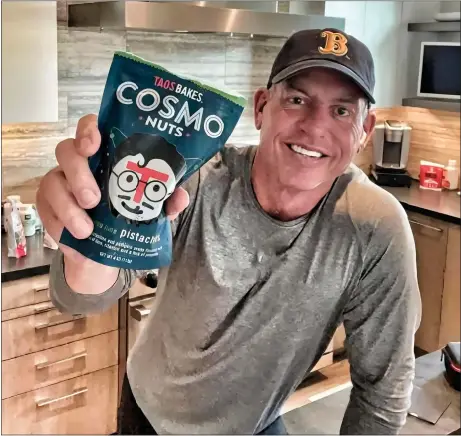  ?? TAOS BAKES’ INSTAGRAM ?? Former NFL player Troy Aikman promotes Taos Bakes Cosmo Nuts in 2021. Taos Bakes is one example of a locally grown business that’s achieved national success, with its very first recipes concocted in the Taos County Economic Developmen­t Center kitchen on Salazar Road.