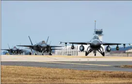  ?? SENIOR AIRMAN COLBY L. HARDIN / U.S. AIR FORCE VIA GETTY IMAGES ?? U.S. Air Force F-16 Fighting Falcon and F-35A Lightning II fighter jets taxi at South Korea’s Kunsan Air Base on Sunday before a large-scale military aircraft and military personnel joint exercise begins.