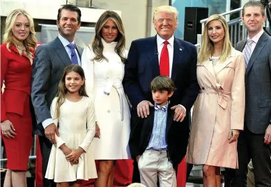  ??  ?? Family ties: Donald and Melania Trump with, from left, children Tiffany Trump, Donald Jr, Ivanka Trump, Eric Trump and grandchild­ren Kai, left, and Donald Trump III, right