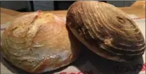  ??  ?? Two sourdough loaves proofed in a banneton, which made the decorative lines.