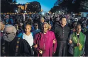  ??  ?? Bishop Curry, centre, star of the royal wedding, leads a US protest