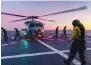  ?? ?? A Seahawk helicopter is ready to take off from HMAS Hobart.