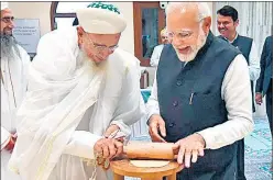  ?? ANI ?? PM Narendra Modi and Dawoodi Bohra community's head, Syedna Mufaddal Saifuddin trying their hand at making a chapati during the inaugurati­on of the Arabic Academy in Marol on Friday.