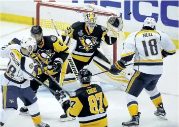  ?? GENE J. PUSKAR/AP PHOTO ?? Penguins goalie Matt Murray denies Nashville with one of his 37 saves in Game 2 of the Stanley Cup Final, Wednesday, in Pittsburgh.