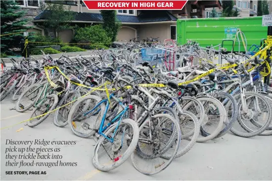  ?? Tijana Martin/calgary Herald ?? Muddy bicycles are piled up at The Wedgewoods complex in Discovery Ridge on Wednesday after they were removed from the building’s flooded parkade.