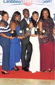  ?? PHOTOS BY CHRISTOPHE­R THOMAS ?? The five awardees at Caribbean HR Solutions’ inaugural grand gala and awards dinner. From left: Patricia Forbes, payroll administra­tor, awarded for Payroll Pro of the Year; Suzane Jackson, recruitmen­t officer, Recruiter of the Year; Ainsley Esmie, sales and marketing manager, MVP of the Year; Tomeisha McKenzie, human resources manager, Leader of the Year; and Annetta Downer, human resources officer, HR Pro of the Year.