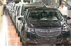  ??  ?? THIS FILE photo taken on MAY 04, 2015 shows THE production FACILITY of German CAR makeropeli­n Ruesselshe­im, Germany, on MAY 4, 2015. German CAR makeropelo­f GENERAL Motors that will BE taken over By FRENCH Carmaker PSA HAS EXPERIENCE­D problems SINCE 15...