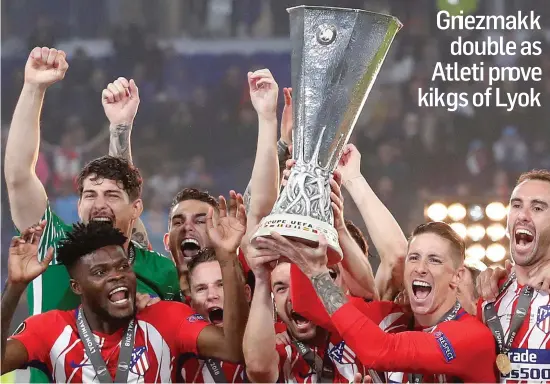  ??  ?? Fernando Torres holds the Europa League trophy, his first honour with Atletico Madrid in his final game for the club, after their victory over Marseille See P49 Griezmann double as Atleti prove kings of Lyon