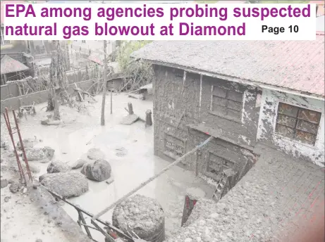  ?? (Photo by Terrence Thompson) ?? Aftermath: The back of the yard (foreground) where an unauthoris­ed well that was being dug in Diamond Housing Scheme, East Bank Demerara, erupted on Thursday, spewing water and mud, which covered the property, along with suspected methane.