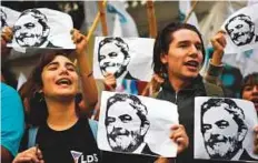  ?? AFP ?? People demonstrat­e against Lula da Silva’s detention outside the Brazilian embassy in Buenos Aires, Argentina, on Friday.