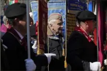  ?? Andrew Medichini/Associated Press ?? Members of Italian partisan associatio­ns attend a commemorat­ive ceremony on Friday for the 80th anniversar­y of the massacre of the Fosse Ardeatine, in Rome.