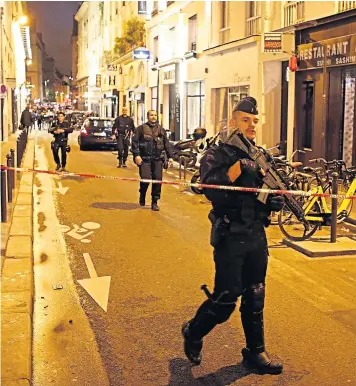  ??  ?? Police guard a street in central Paris after one person was killed and several injured by a man armed with a knife, who was shot dead
