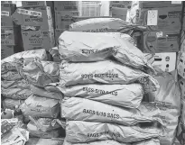  ?? Saltwire file ?? Bags of P.E.I. potatoes are stored at a warehouse along with other food in this undated photo.