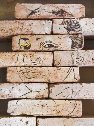  ?? COURTESY OF THE WHEELWRIGH­T MUSEUM OF THE AMERICAN INDIAN ?? Gabriela Muñoz (Latinx) and M. Jenea M. Sanchez (Latinx), “Labor/Retratos 1, Mujeres de DougaPriet­a Trabaja,” 2016. Serigraph on handmade Mexican bricks, 42x6x24 inches.