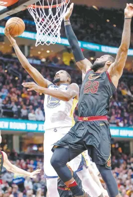  ?? AFP PHOTO ?? Kevin Durant No.35 of the Golden State Warriors shoots the ball against LeBron James No.23 of the Cleveland Cavaliers at Quicken Loans Arena on Tuesday in Cleveland, Ohio.