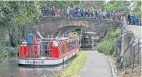  ?? PHOTO: STUART RENNIE/SCOTTISH WATERWAYS FOR ALL ?? Crowds on Manse Road Bridge (bridge 43) as the flotilla sails into the canal basin at Linlithgow.