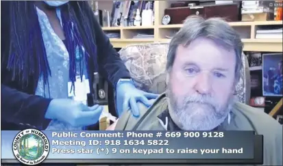  ?? SCREENSHOT ?? First District Supervisor Rex Bohn receives a flu vaccine during the supervisor­s’ meeting on Tuesday morning.