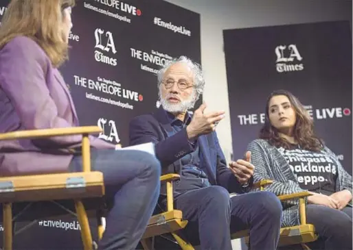  ?? Photograph­s by Ana Venegas For The Times ?? “ELDORADO” director Markus Imhoof, center, with Amnesty Internatio­nal’s Muna Sharif, right, at an Envelope Q&amp;A.