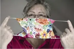  ??  ?? Retired paramedic Anne Hernandez, 54, started sewing face masks when her niece, a nurse in Colorado, told her they didn’t have enough.