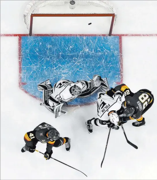  ?? Richard Brian ?? Las Vegas Review-journal @vegasphoto­graph A shot by Golden Knights defenseman Shea Theodore, not pictured, gets past Los Angeles Kings goaltender Jonathan Quick (32) during the first period Wednesday.