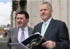  ??  ?? Brian Mehigan, chief financial officer, and Stan McCarthy, chief executive, with Kerry’s results. Photo: Colm Mahady/Fennells