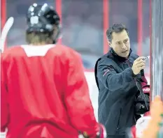  ?? WAYNE CUDDINGTON/ POSTMEDIA NETWORK ?? Ottawa Senators coach Guy Boucher gives instructio­ns as the team practices at the Canadian Tire Centre in Ottawa during training camp.