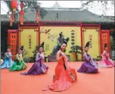  ?? AN YUAN / CHINA NEWS SERVICE ?? Dancers perform at the Chengdu Du Fu Thatched Cottage Museum in Chengdu, Sichuan province, on Thursday. The seventh day of the first lunar month, known as “the day of the people”, is a time that Chengdu residents visit the cottage to pay respects to...