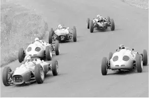  ??  ?? Above: At the Nürburgrin­g in 1961 Dan starts and finishes seventh. He is outside right at the start with Brabham leading, followed by Stirling Moss, Jo Bonnier and Phil Hill
Above right: Dan is preparing to leave the pits after a long stop to fix an ignition problem at the Nürburgrin­g. Huschke van Hanstein leans into the cockpit next to co-driver Jo Bonnier