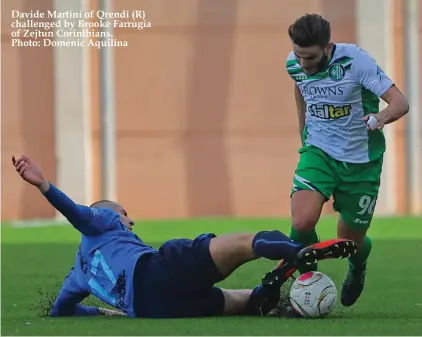  ??  ?? Davide Martini of Qrendi (R) challenged by Brooke Farrugia of Zejtun Corinthian­s. Photo: Domenic Aquilina