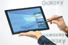  ??  ?? The new Samsung Galaxy Book is displayed during its presentati­on at Mobile World Congress in Barcelona.