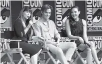  ?? PHOTO BY CHRIS PIZZELLO/INVISION/AP ?? From left, Patty Jenkins, Chris Pine and Gal Gadot speak at the Warner Bros. theatrical panel for “Wonder Woman 1984” on Saturday at Comic-Con Internatio­nal in San Diego.