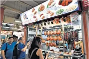  ?? ?? Ruling the roost: the chicken stall at Hawker Chan is cheap and delicious