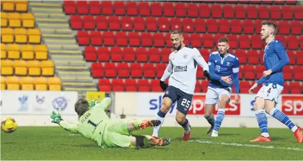  ??  ?? Kemar Roofe scores Rangers first goal against St Johnstone