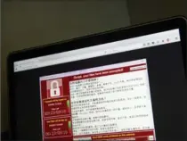  ?? MARK SCHIEFELBE­IN, THE ASSOCIATED PRESS ?? A screenshot of the warning screen from a purported ransomware attack.