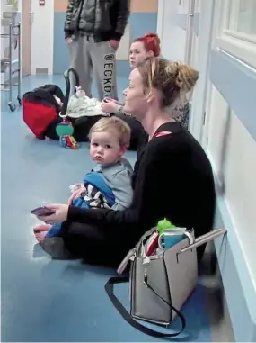  ??  ?? Mothers in limbo: Parents who brought their ill babies to the Royal Blackburn A&E department found that not only were there no beds available, there were no chairs